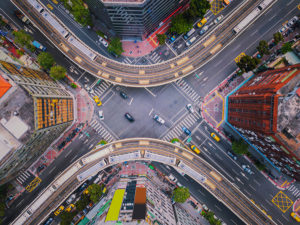 Aerial View Of Cars And Trains With Intersection Or Junction Wit