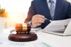 Justice Symbol Wooden Gavel On Table. Attorney Working In Office